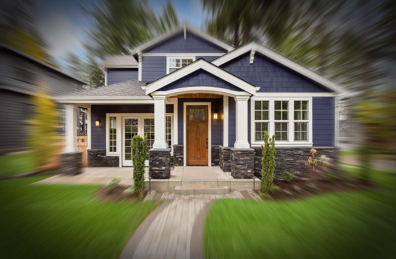 Front of a house in daylight from the perspective of someone with Bardet-Biedl syndrome. Second of five stages.