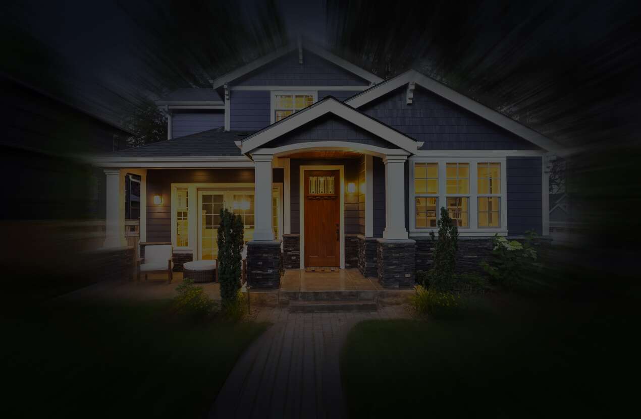 Front of a house at night from the perspective of someone with choroideremia. Third of five stages.