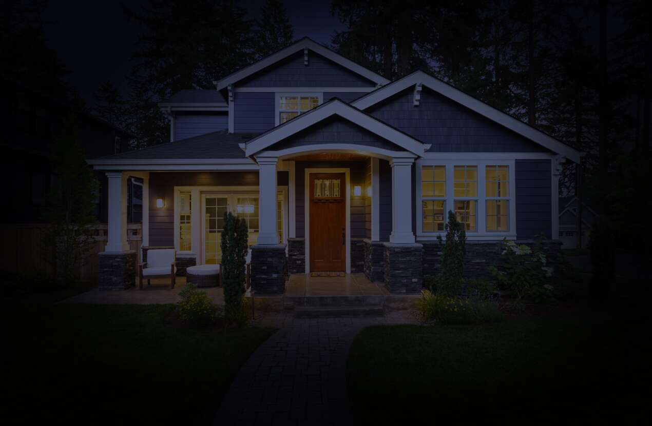 Front of a house at night from the perspective of someone with retinitis pigmentosa. Second of five stages