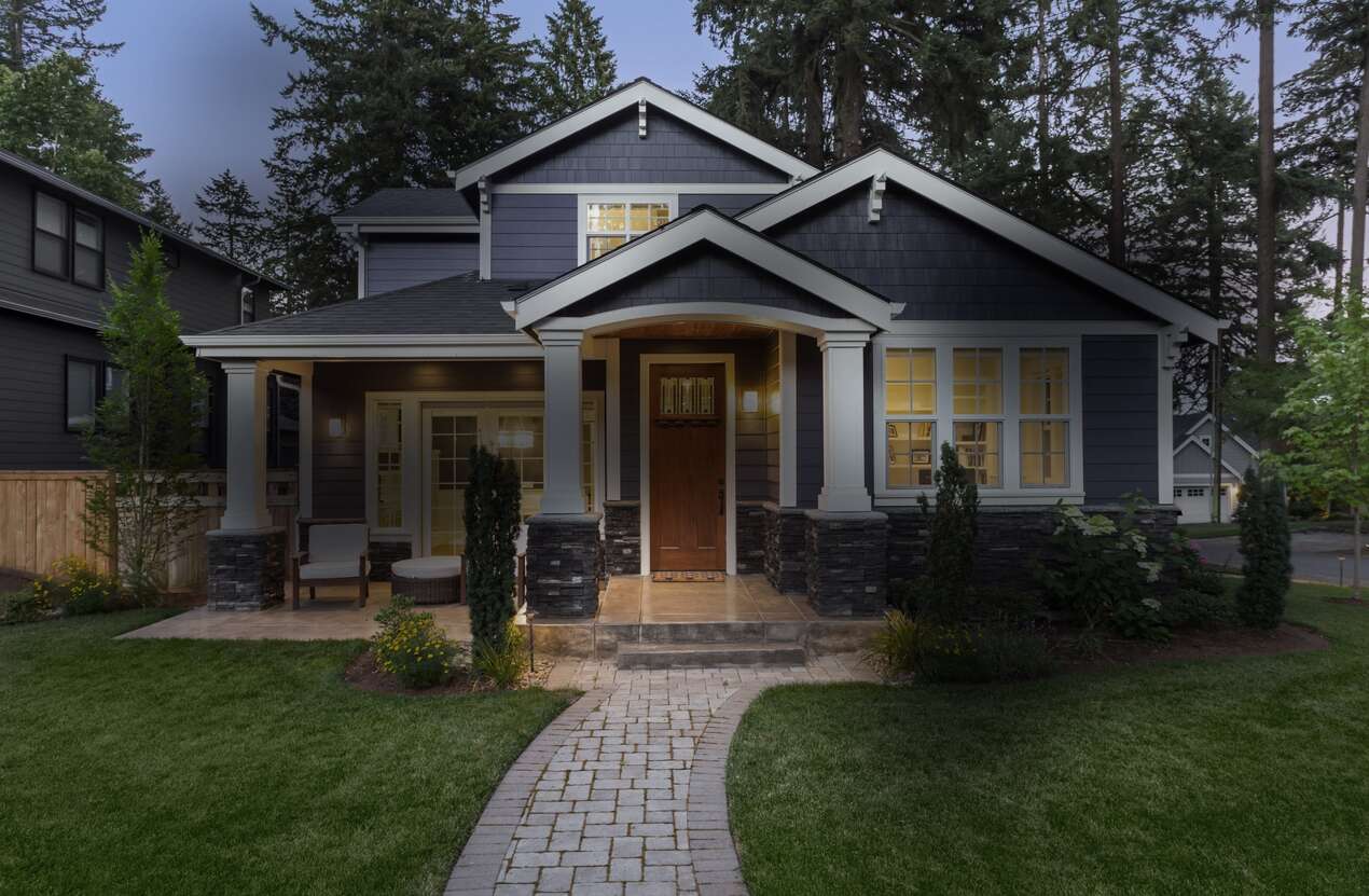 Front of a house at night from the perspective of someone with Stargardt disease. First of five stages.