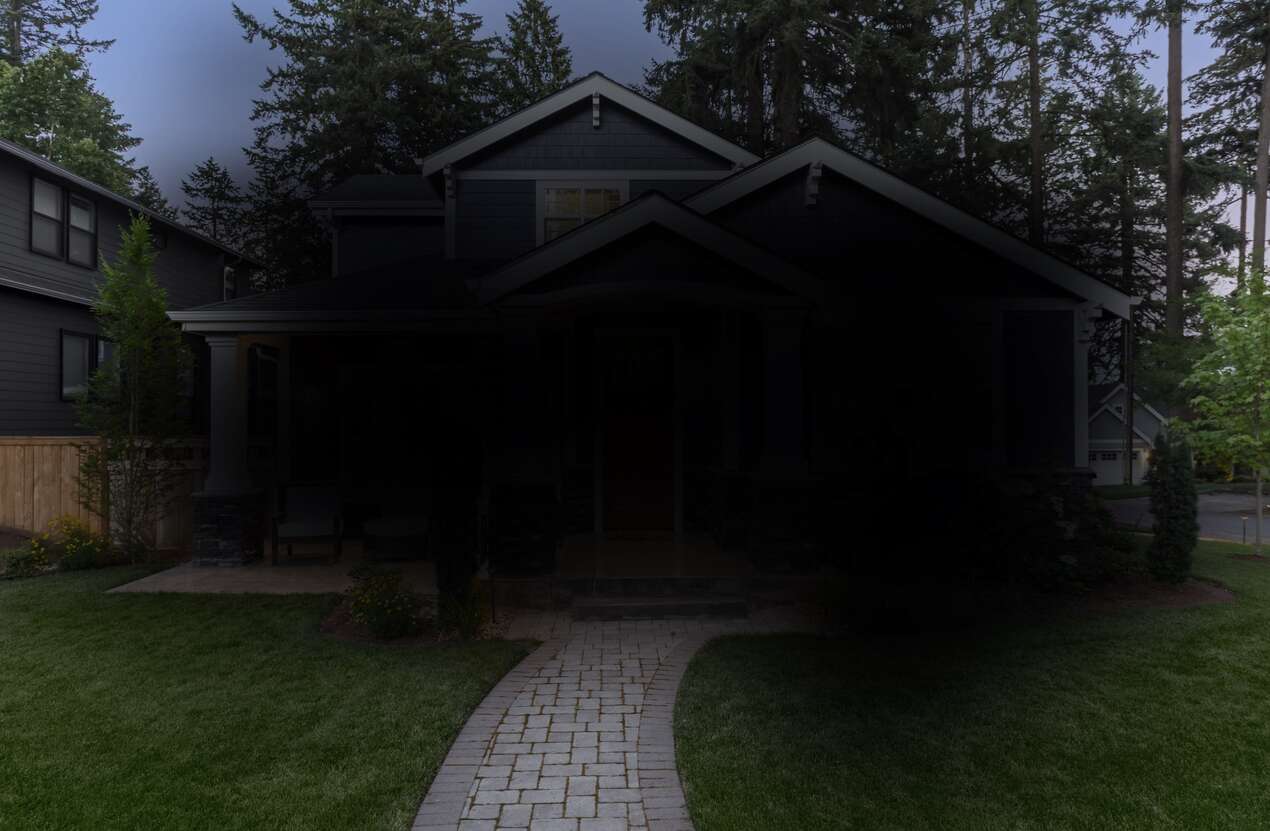 Front of a house at night from the perspective of someone with Stargardt disease. Fifth of five stages.